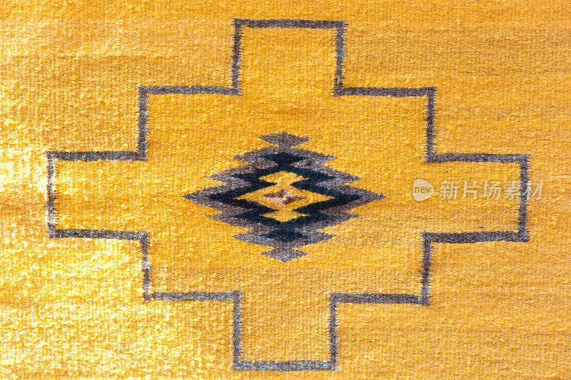 传统的充满活力的黄色墨西哥羊毛地毯/纺织细节(特写)